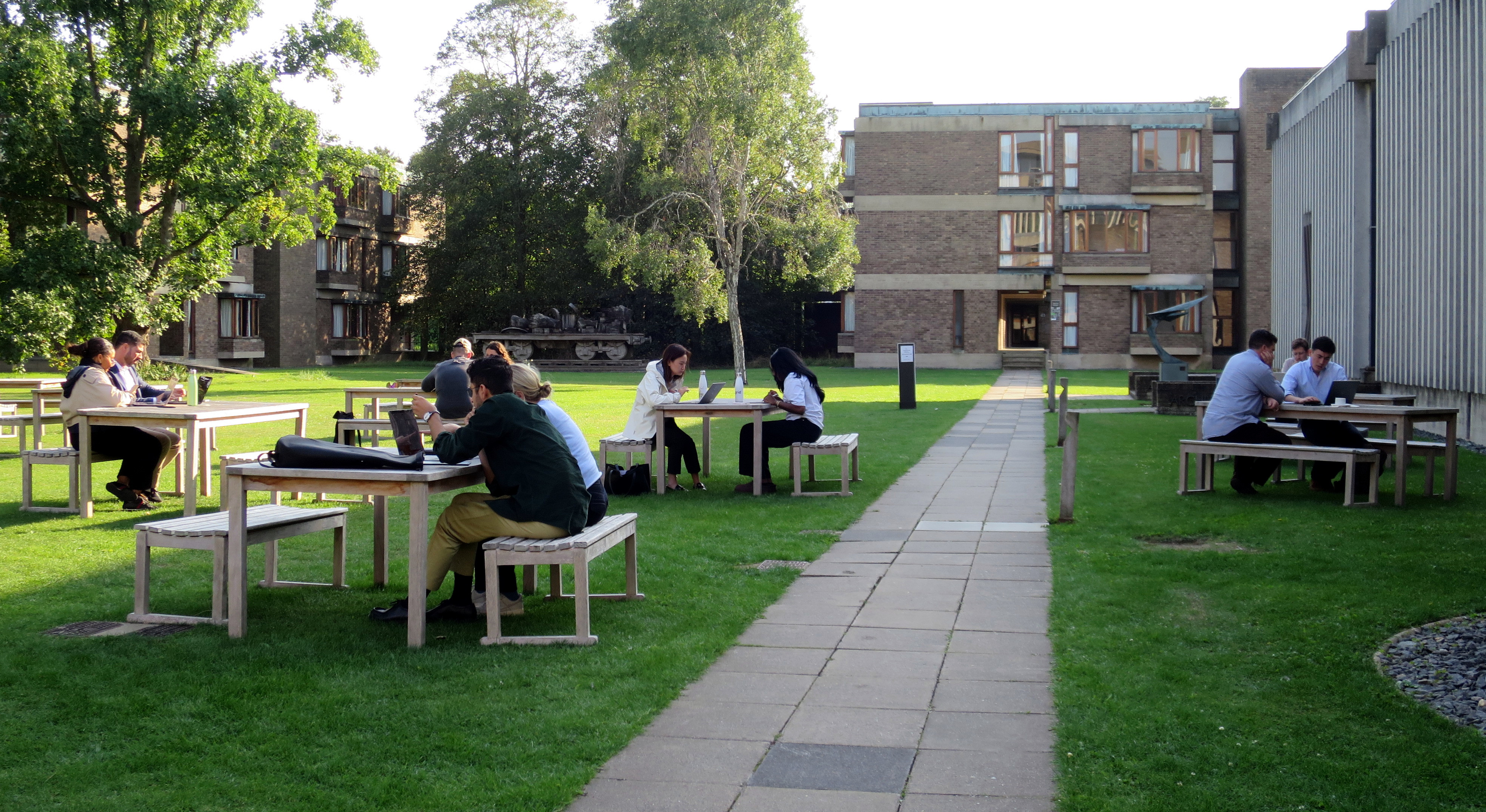 MSt CEUP students working outside at Churchill College during one of their residentials